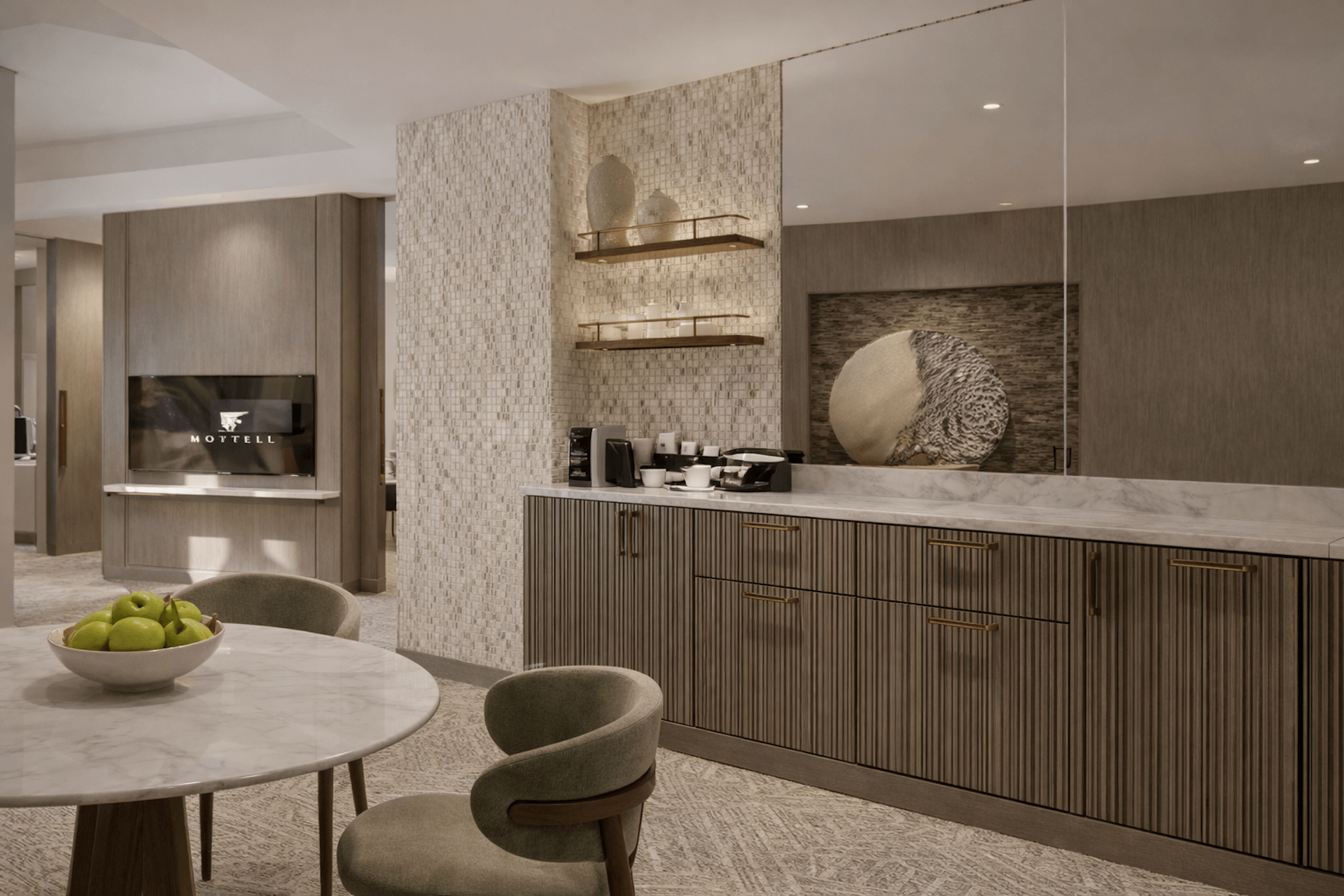 Modern luxury spa reception area with marble counter, textured tile walls, and contemporary furniture
