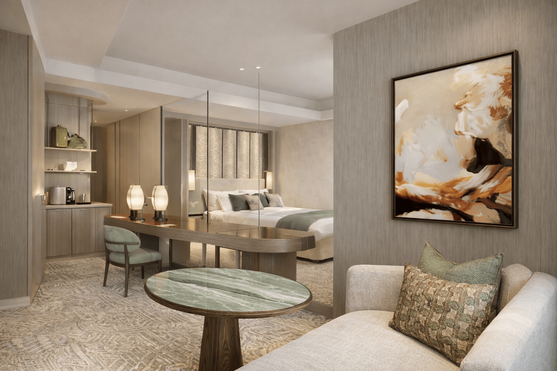 Modern luxury hotel suite with marble table, desk, bedroom and contemporary artwork