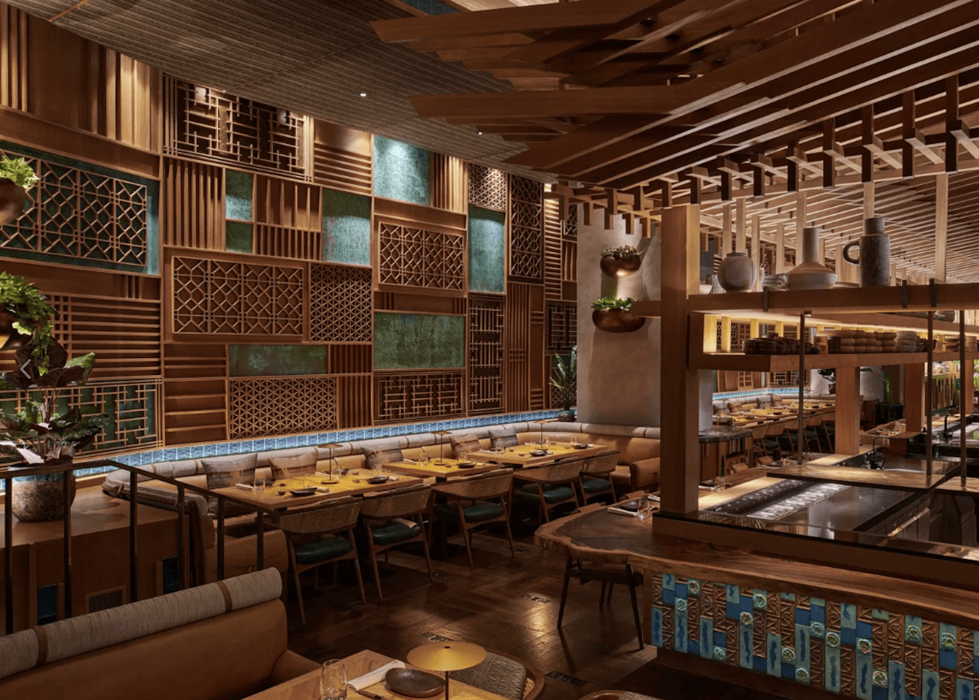 Upscale Asian restaurant interior with wooden lattice panels, blue tile accents, and dining tables.