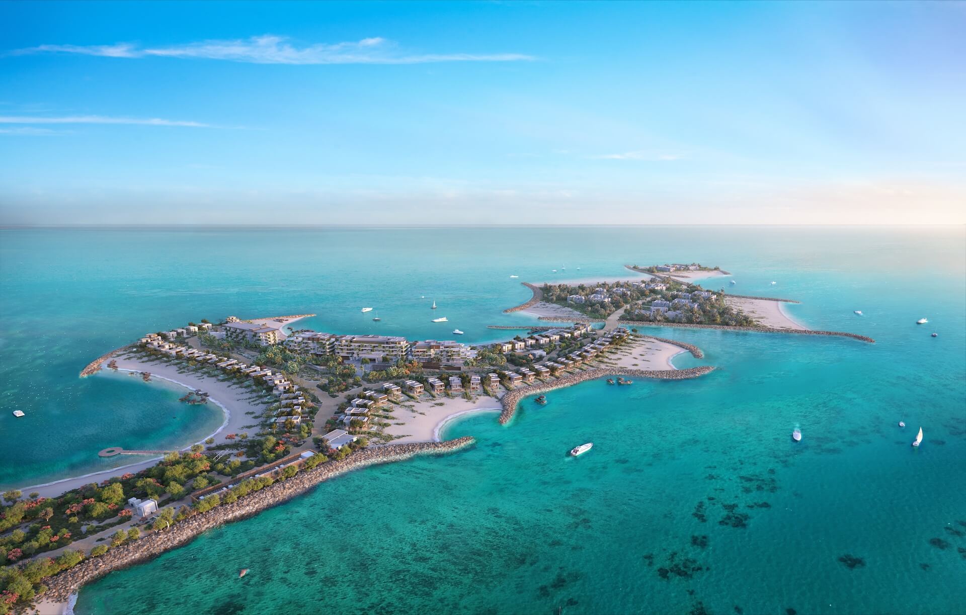 Aerial view of tropical island resort with turquoise water, sandy beaches, and modern buildings
