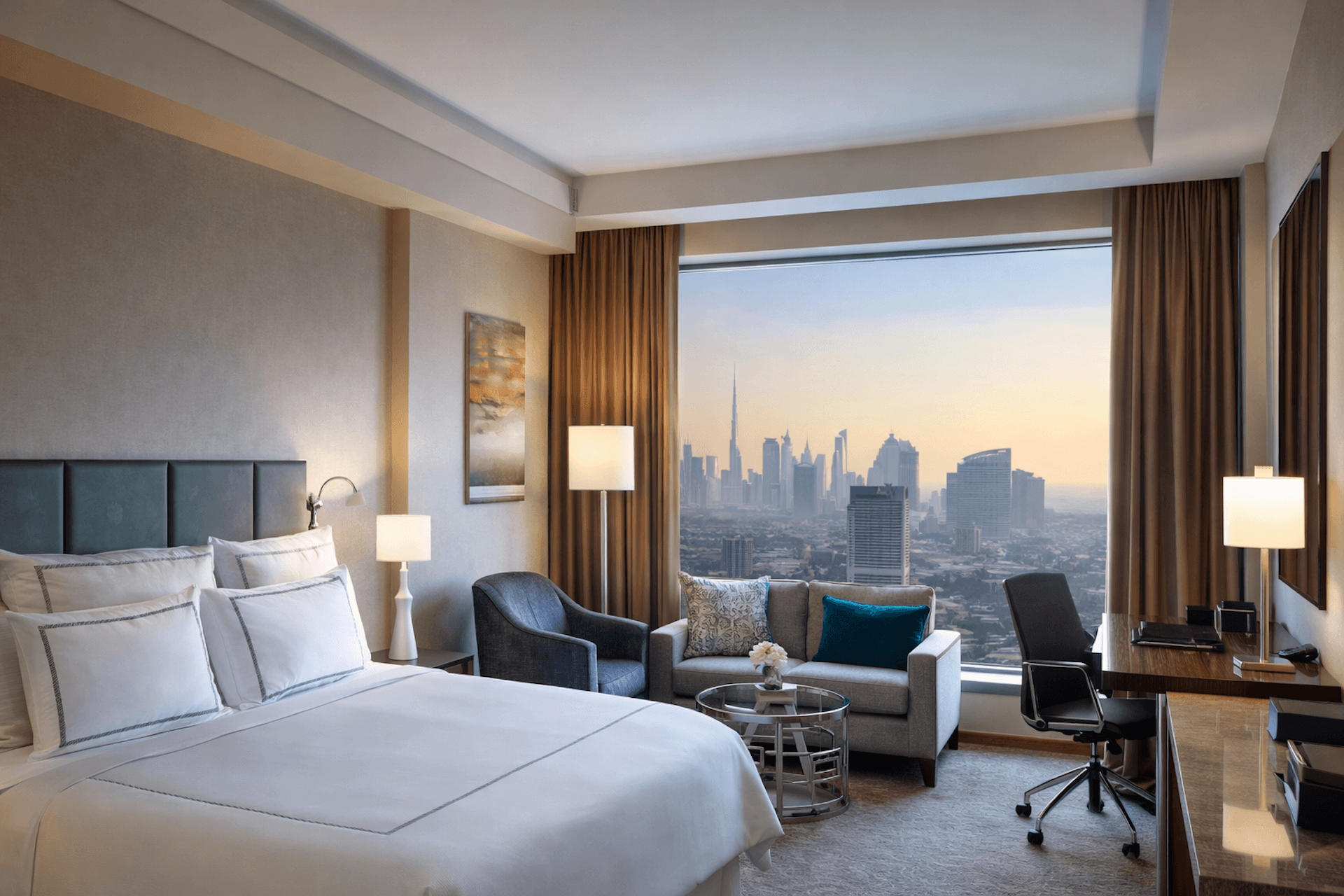 Modern luxury hotel room with city skyline view through floor-to-ceiling windows and contemporary furnishings
