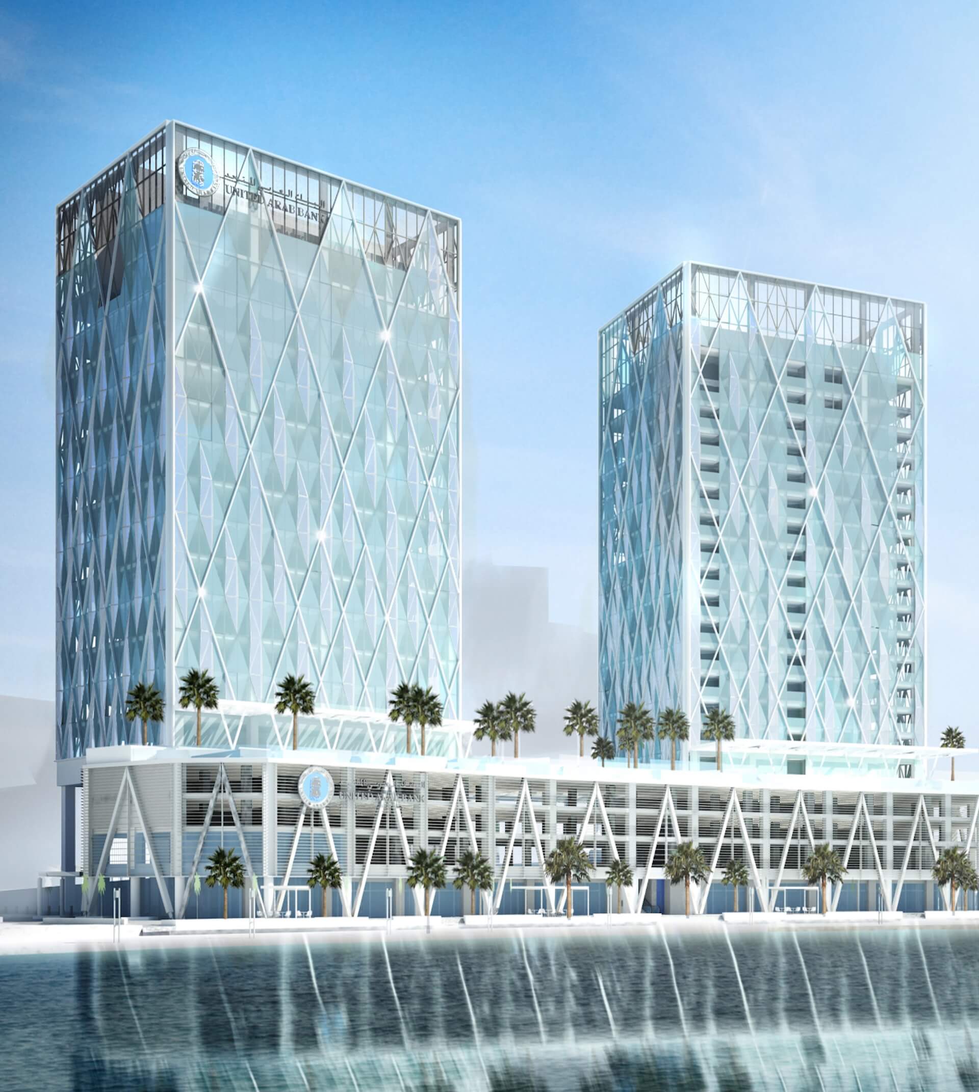 Two modern glass towers with diamond lattice pattern overlooking waterfront with palm trees.