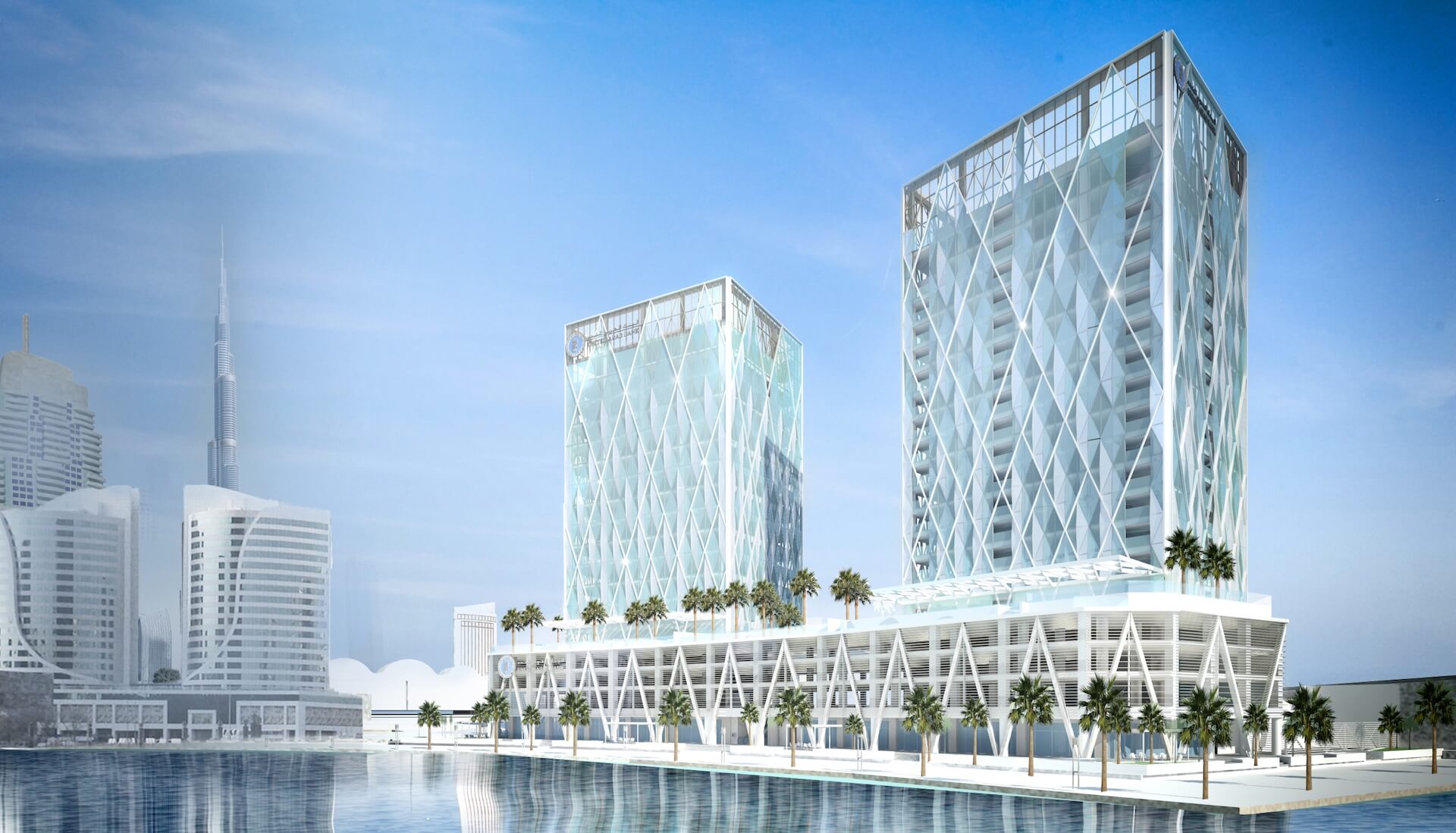 Modern waterfront complex with white lattice-patterned residential towers and geometric base structure