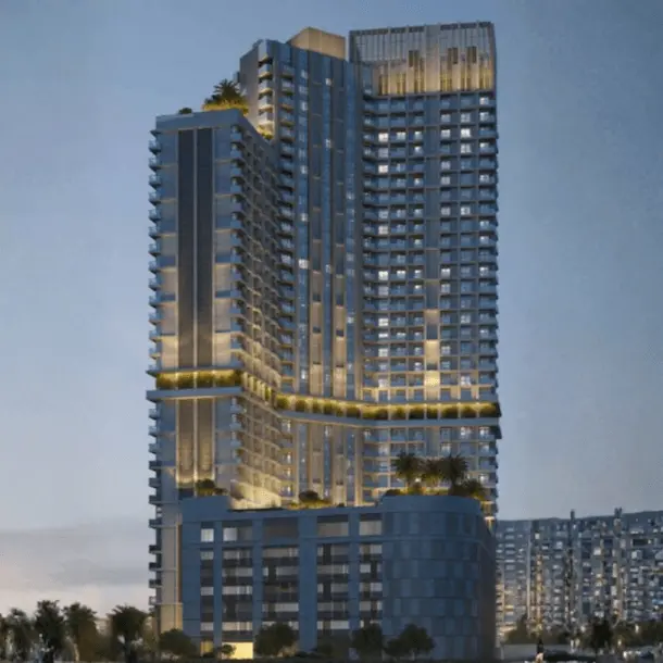 Modern high-rise residential building with illuminated golden accent lighting at dusk
