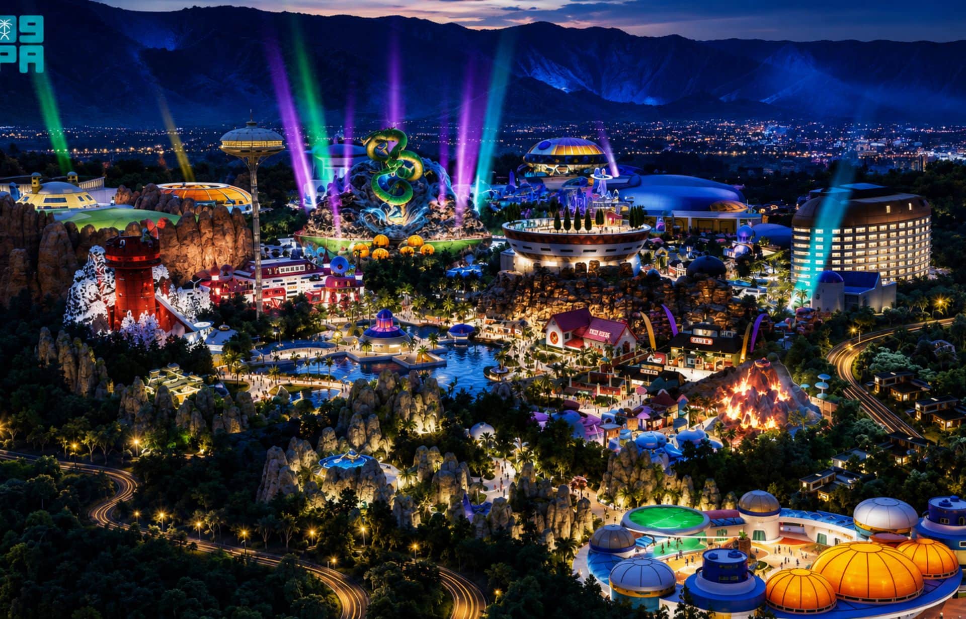 Illuminated theme park at night with colorful attractions, purple light beams, rocky formations, and city lights.
