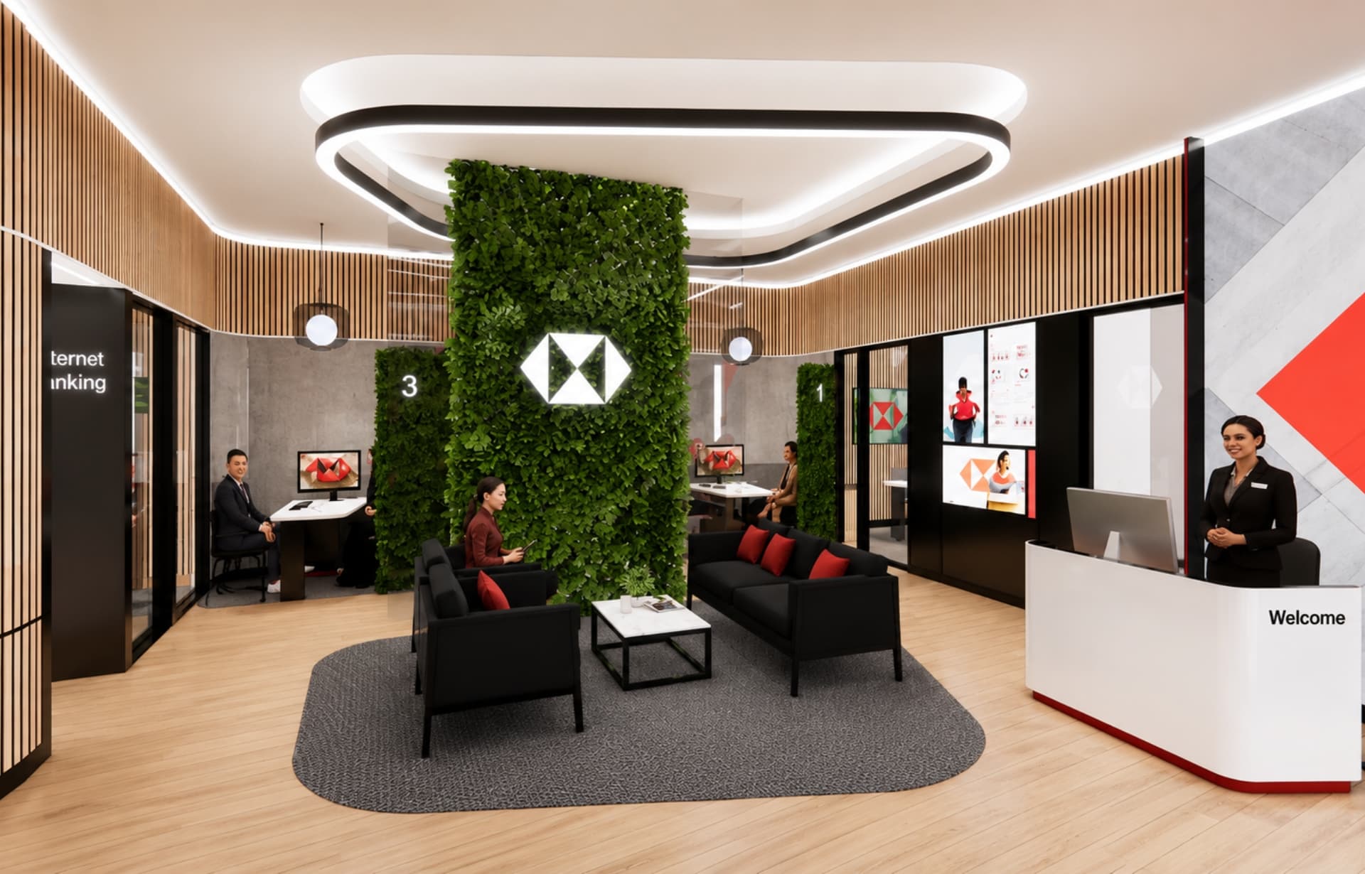 Modern office lobby with green living wall, welcome desk, black furniture, and employees