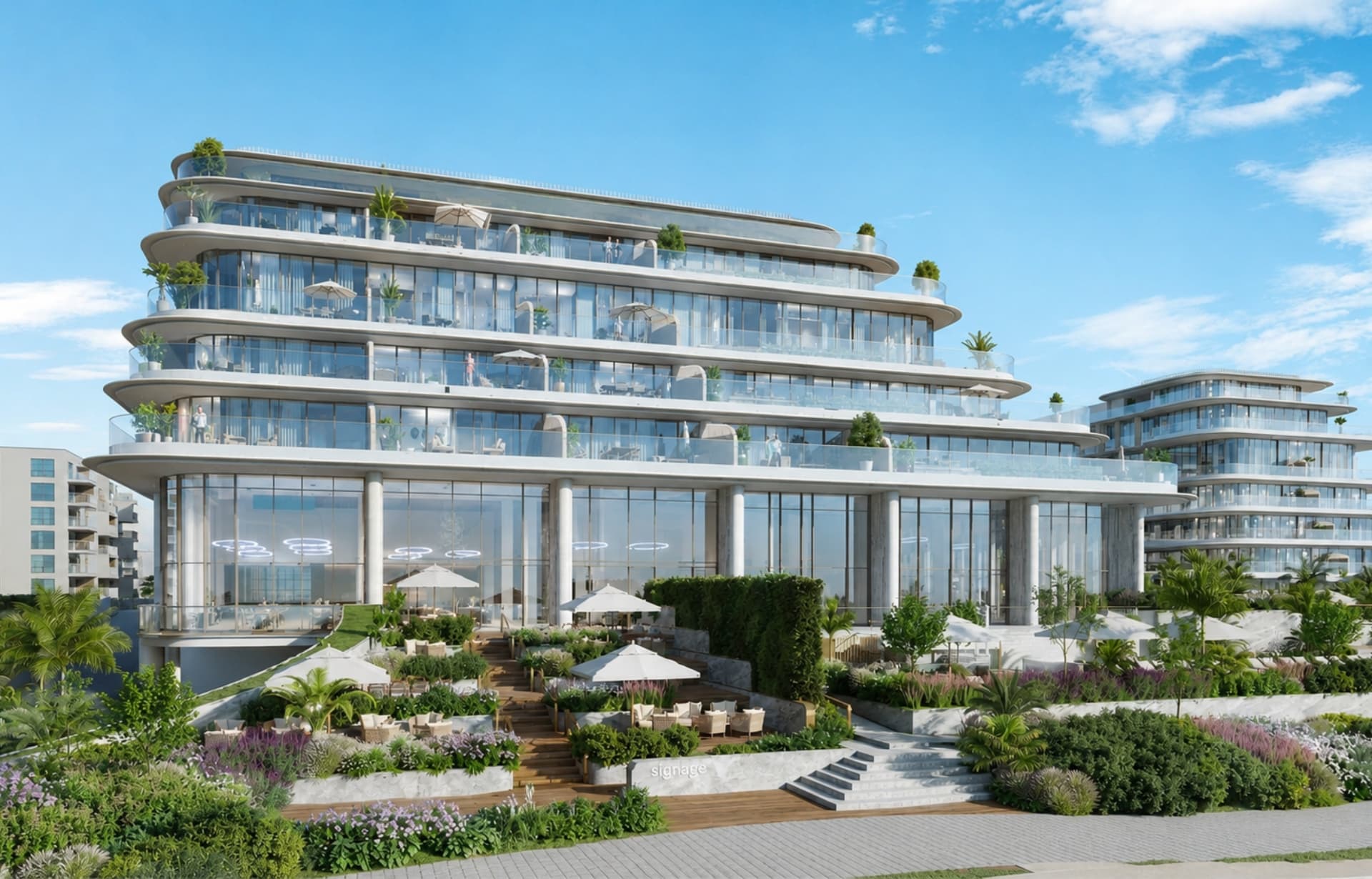 Modern curved waterfront building with balconies, glass, plants, and outdoor terrace area.