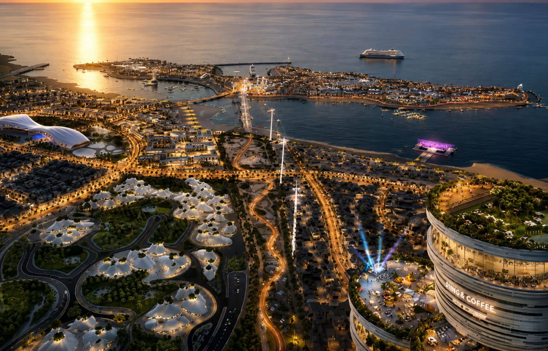 Aerial sunset view of modern coastal city with illuminated streets, white buildings, beach, and cruise ship