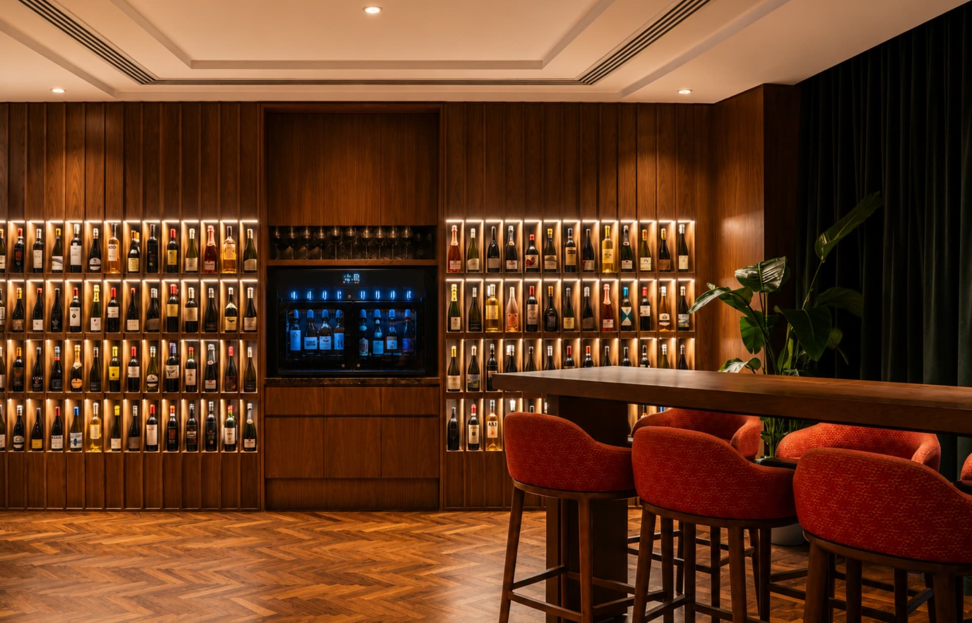 Upscale whiskey lounge with illuminated wood shelving, bar seating, and modern ambient lighting