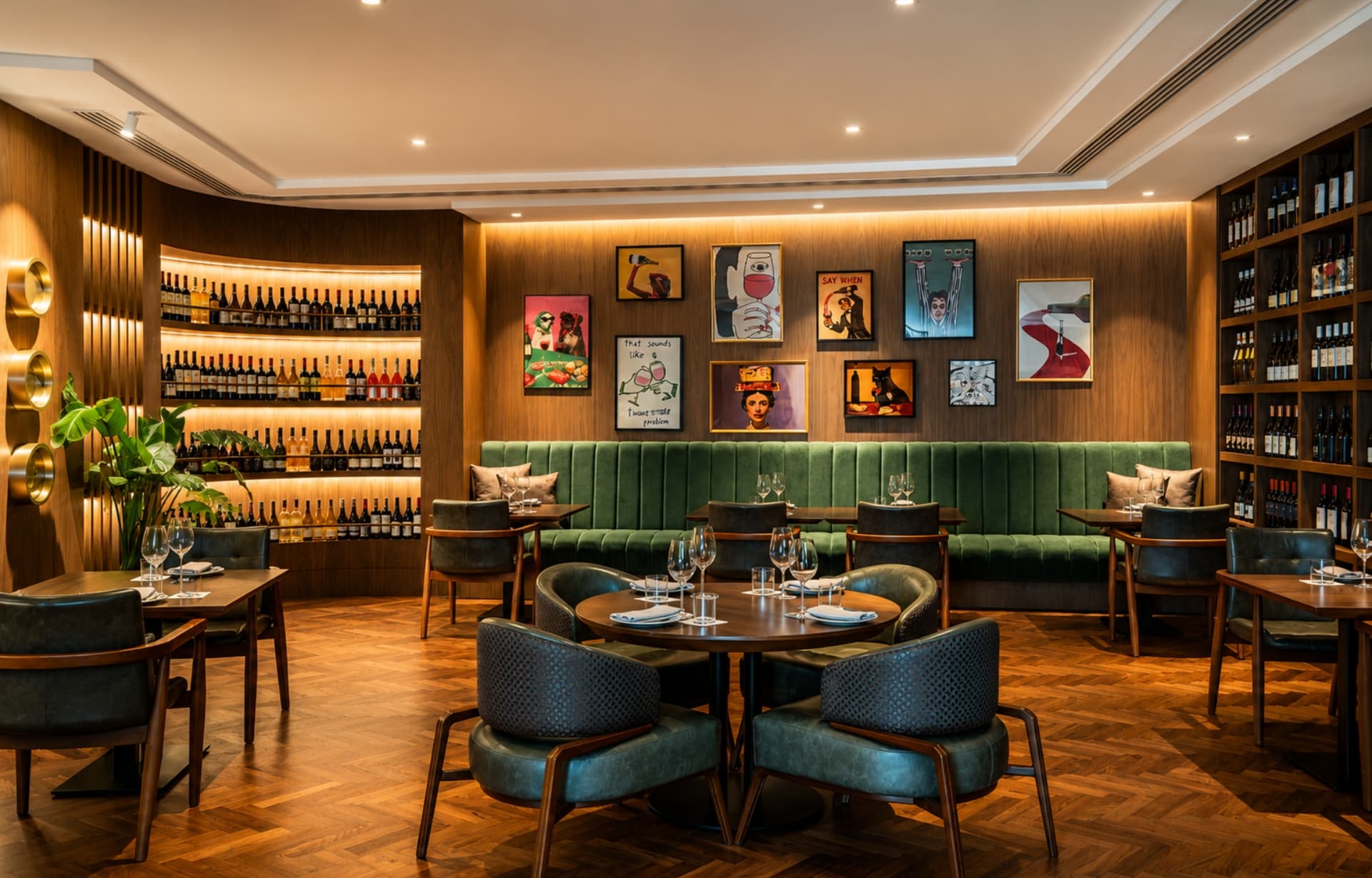 Modern upscale restaurant interior with wine displays, artwork, green banquette seating, and contemporary furnishings