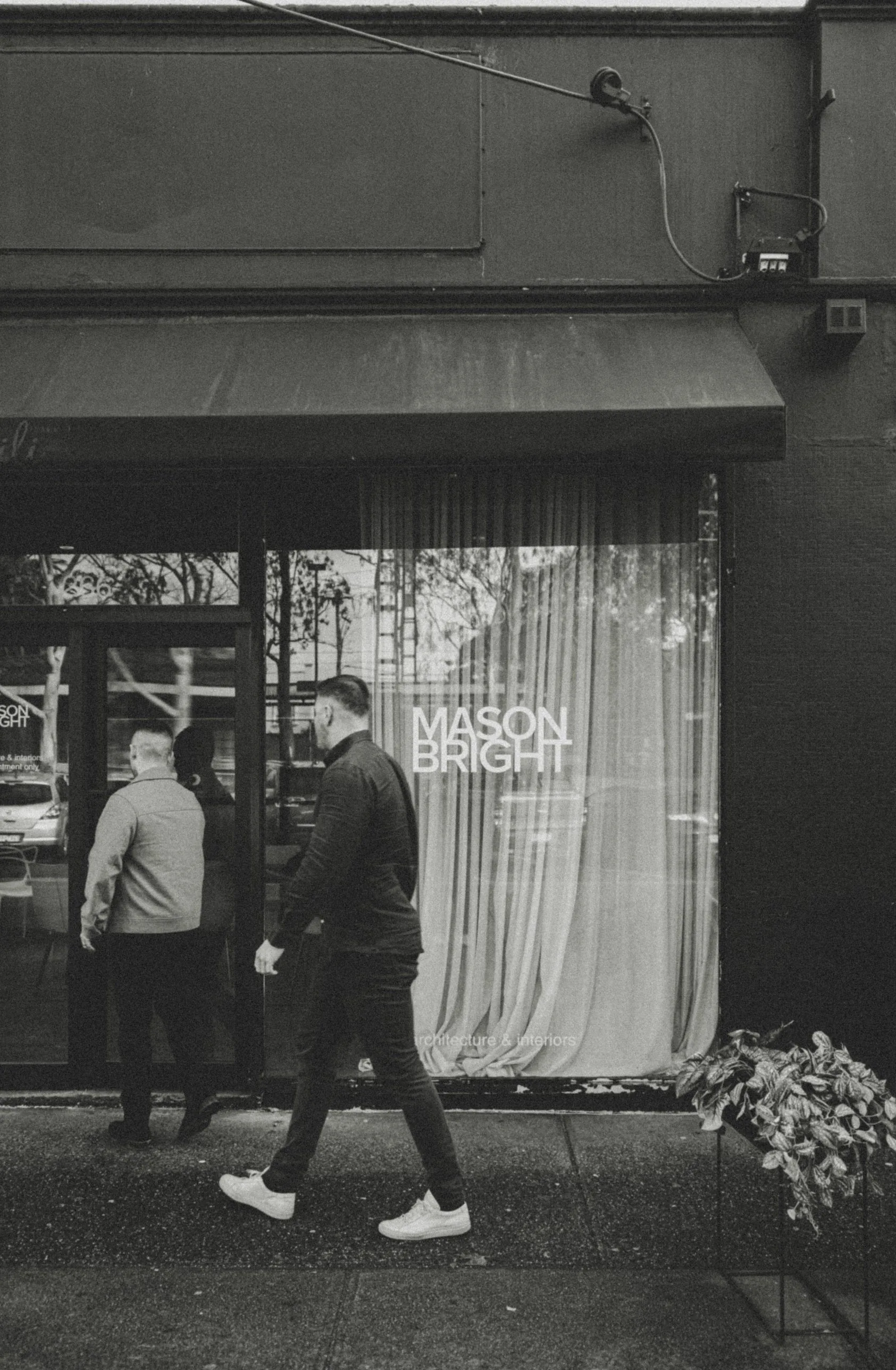 Cal and Matt walking past the Mason Bright studio