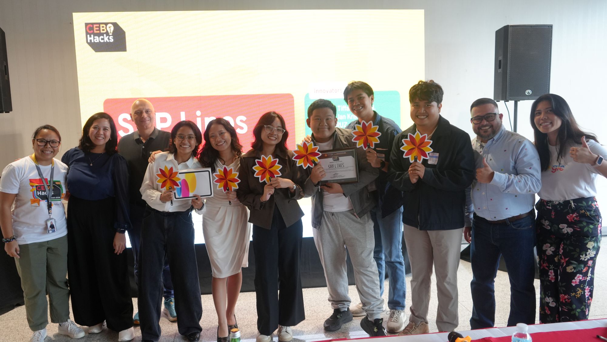 CEB-i Hacks Demo Day award ceremony — winning team SkipLines on stage, January 23, 2026