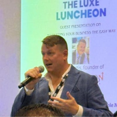 Illustration of a woman with dark hair wearing a pink shirt inside a blue circular background.