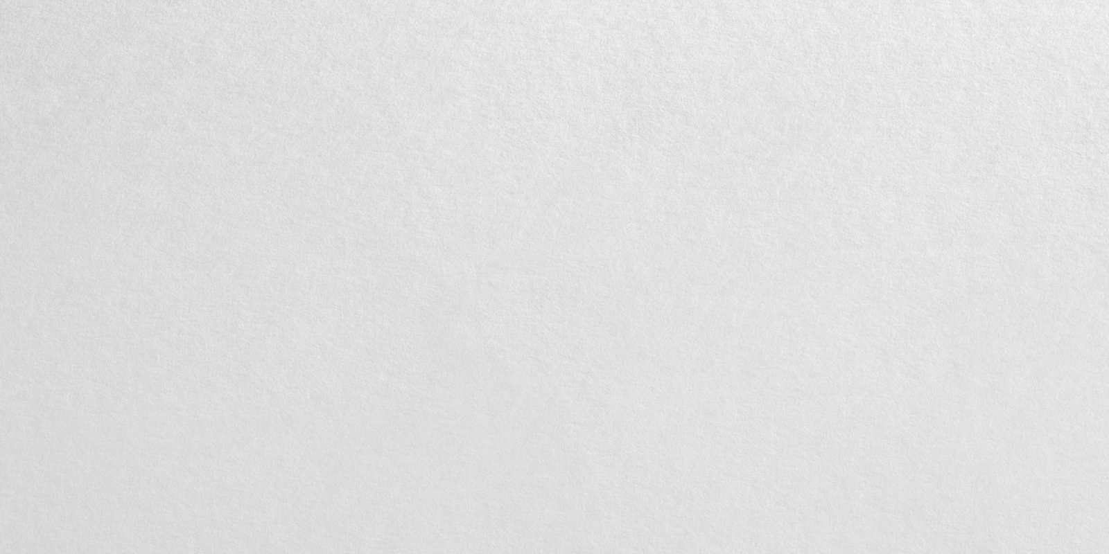Close-up of a textured gray surface resembling rough paper or fabric.