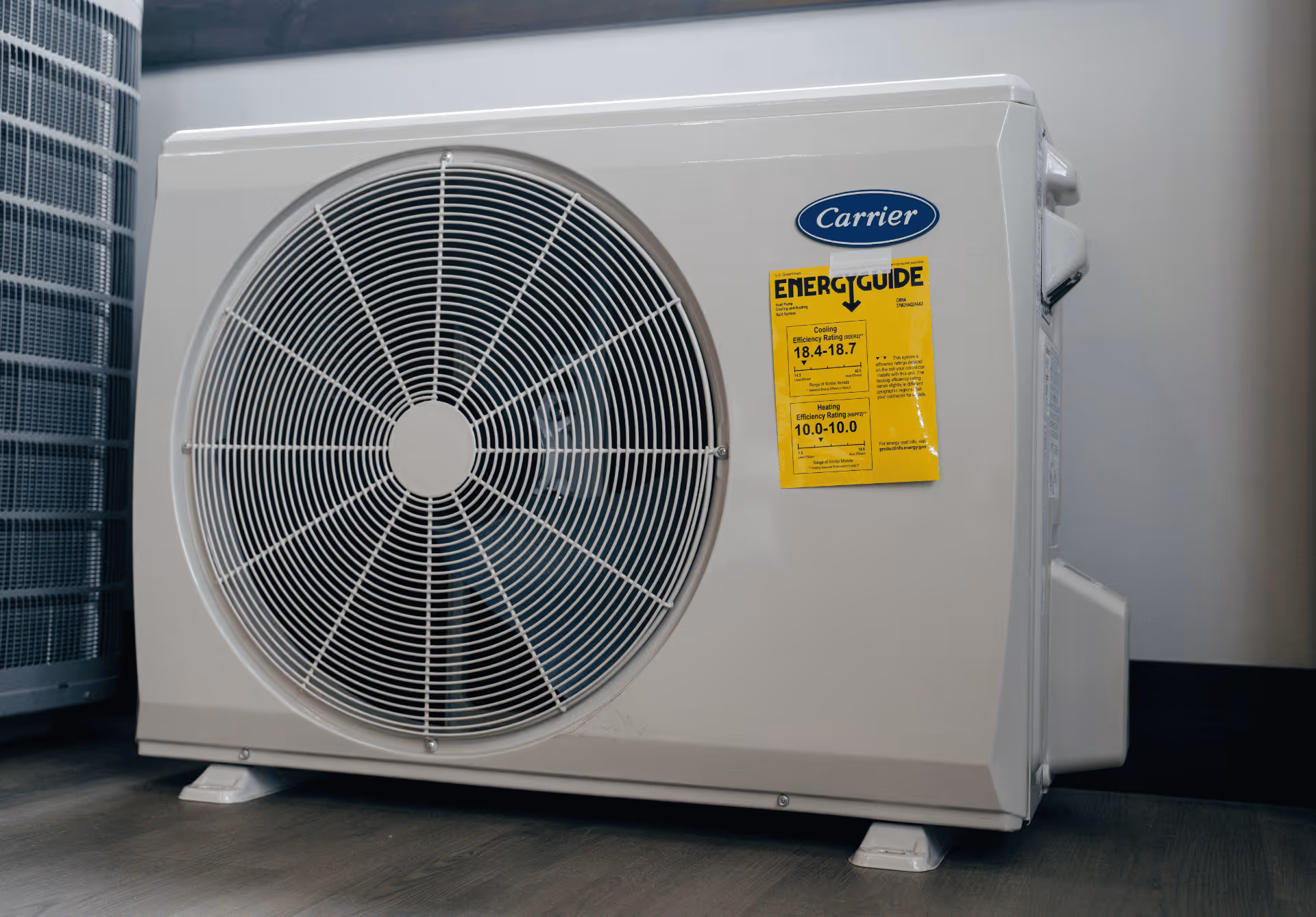 New high efficiency outdoor HVAC unit beside a home