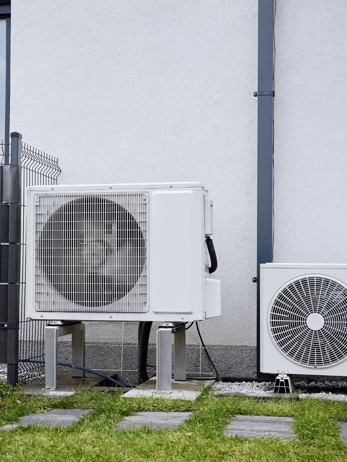 Outdoor heat pump unit outside a Northern Michigan home