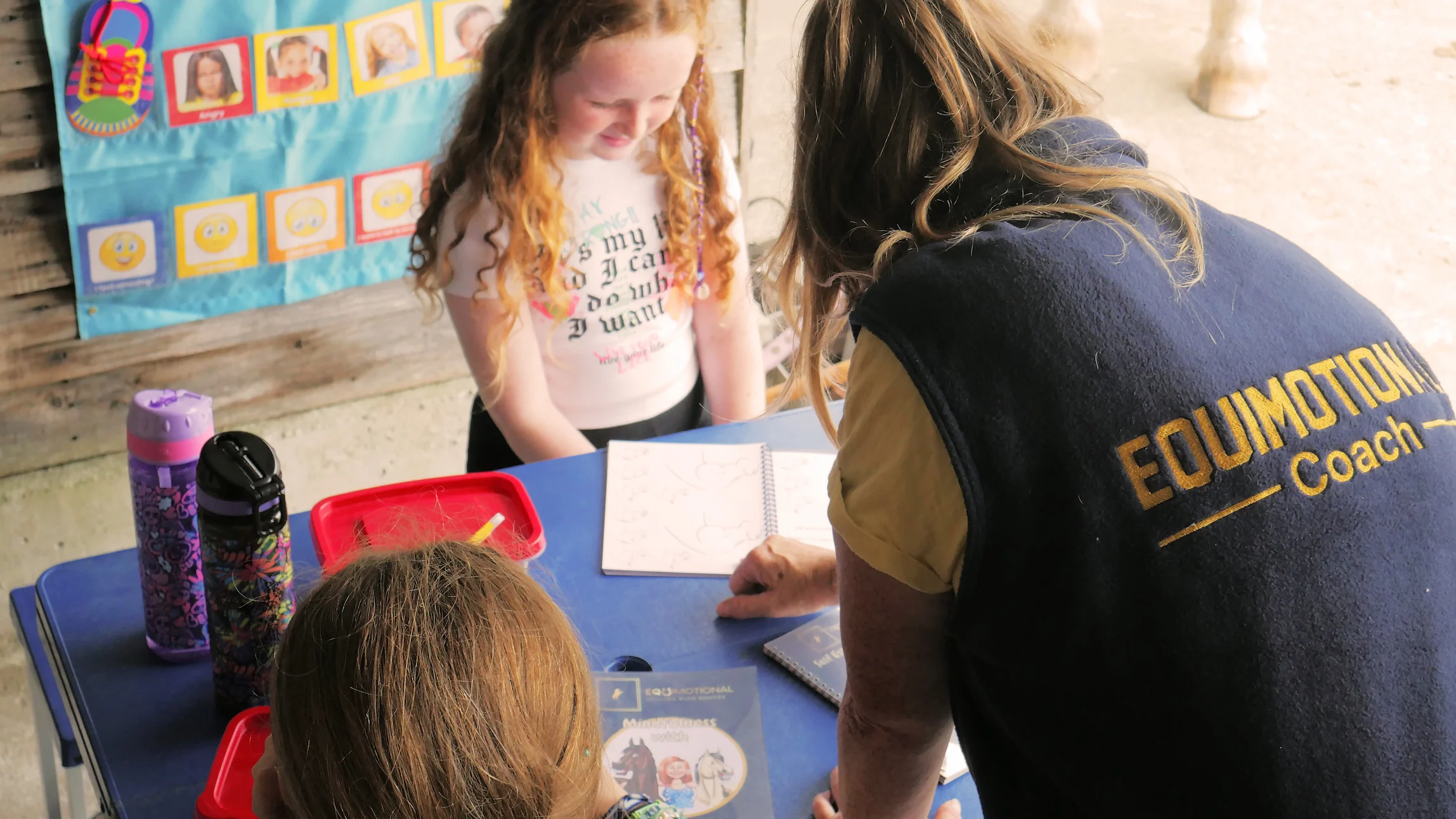 Majella (woman) showing kids drawings in the books