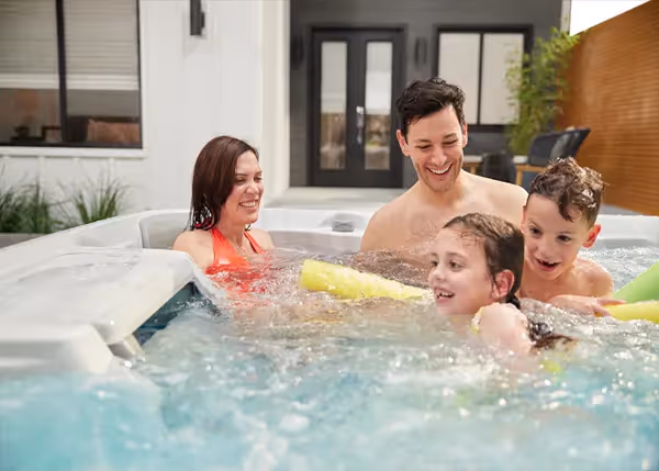 Friends socializing in outdoor hot tub
