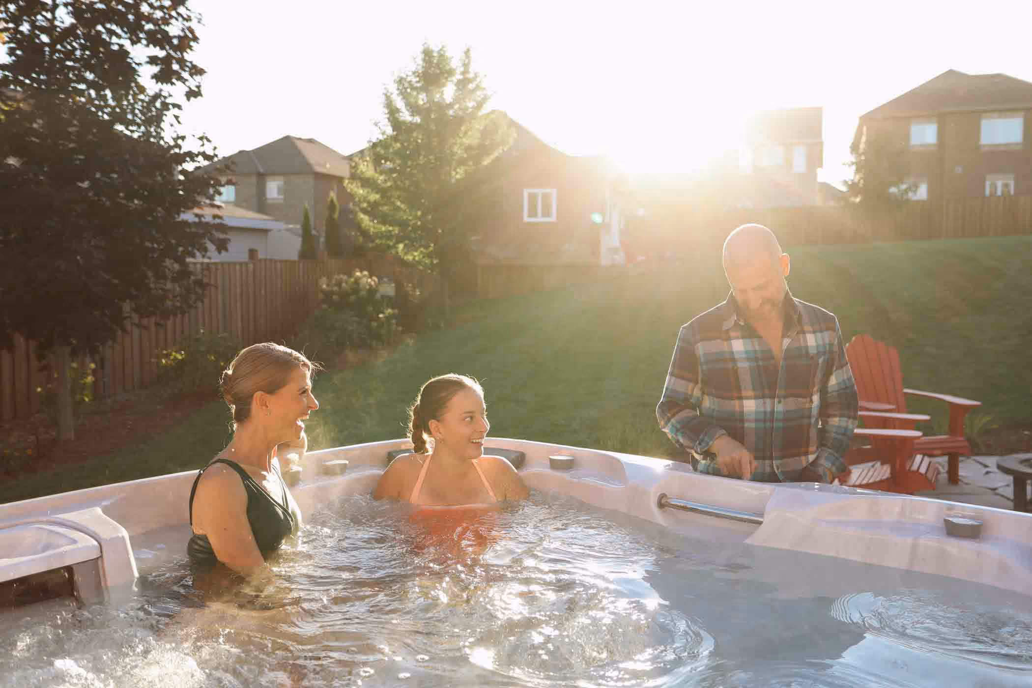 Friends unwinding in outdoor spa