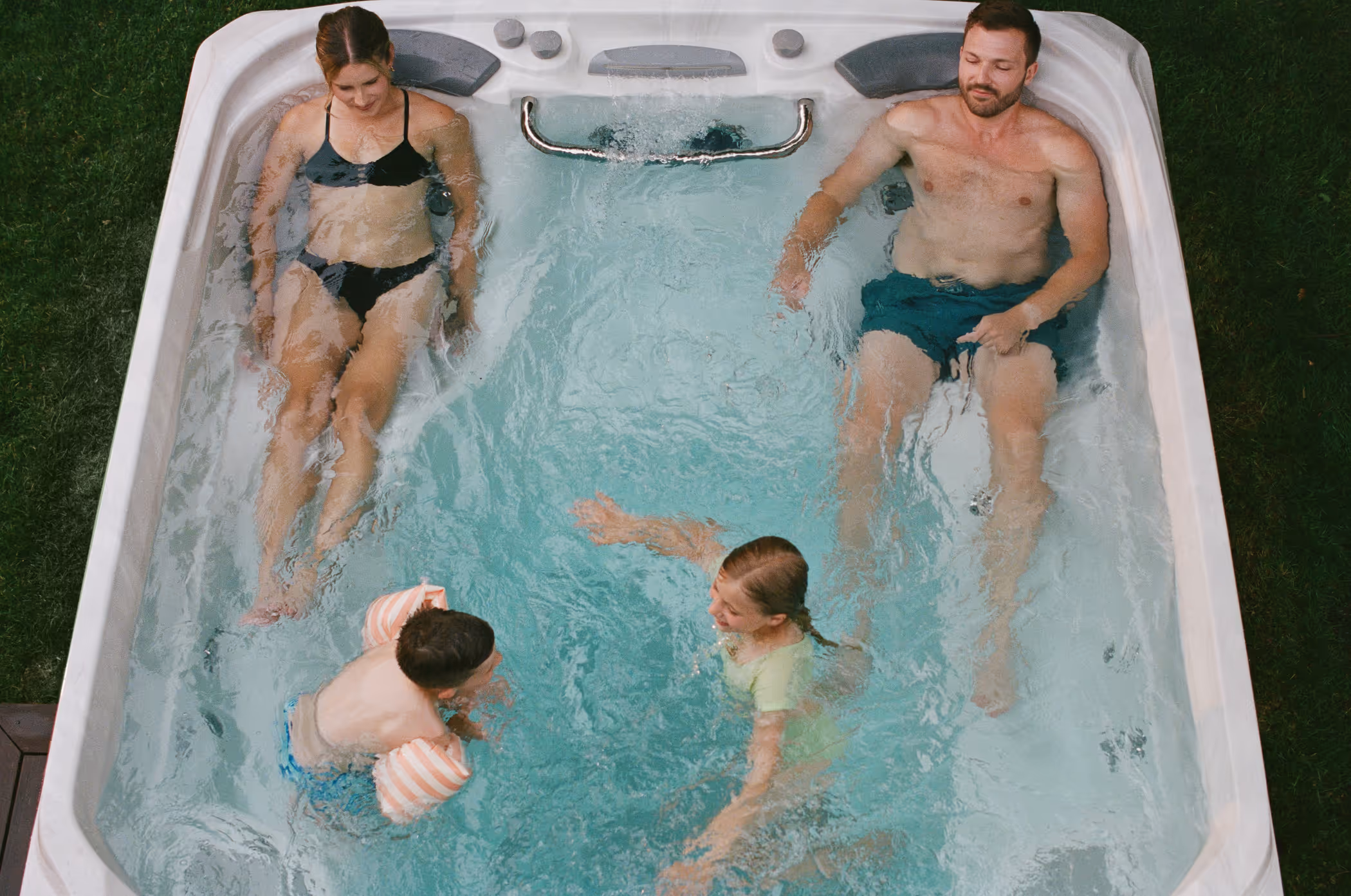 family enjoying time in their swim spa