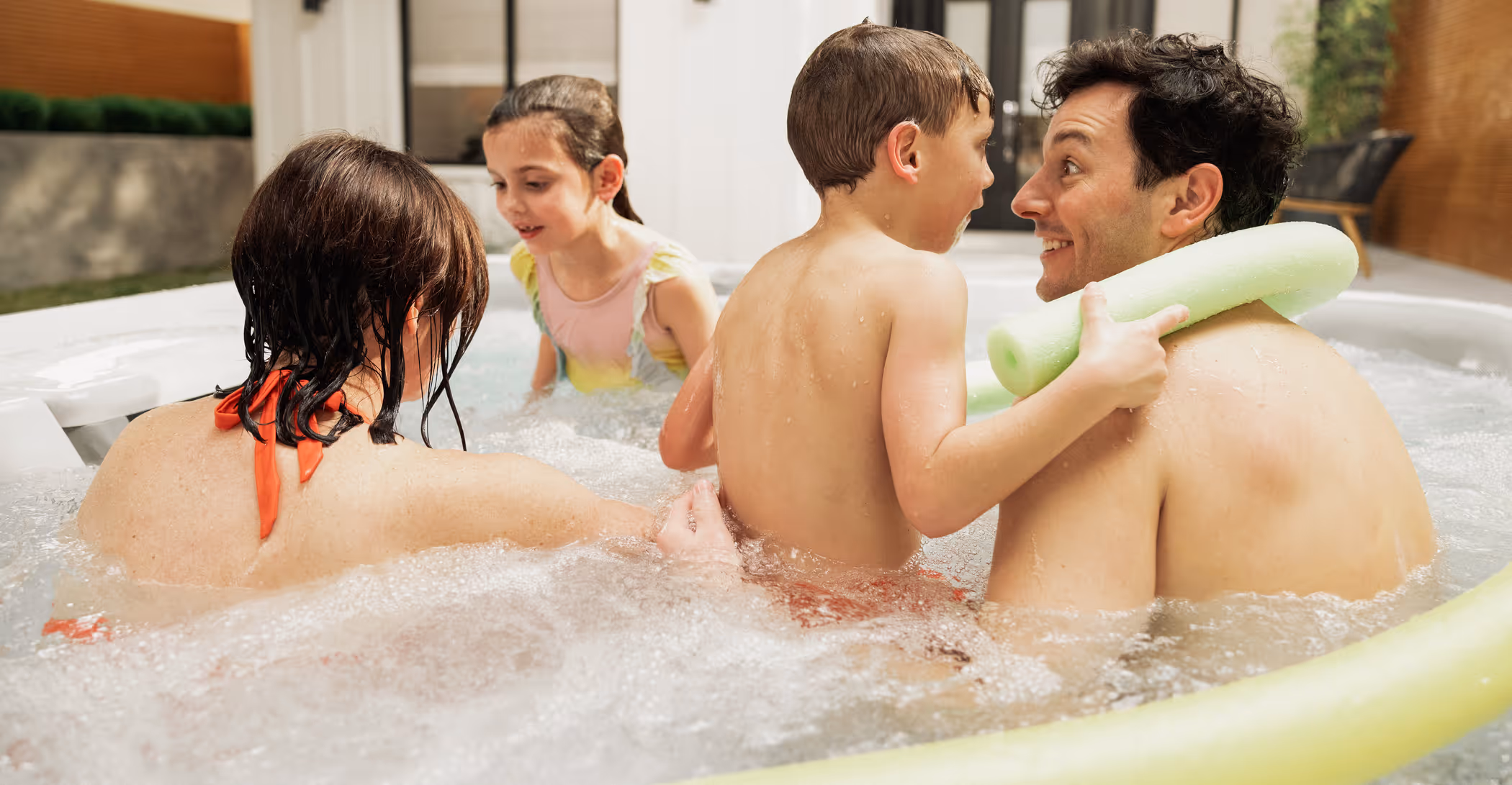 Family enjoying hot tub