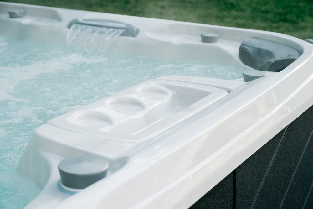 Detailed view of a Sundance Spa hot tub with a waterfall feature