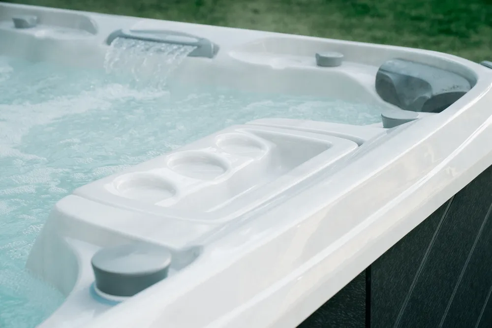 Detailed view of a Sundance Spa hot tub with a waterfall feature