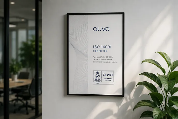 ISO 14001 certificate framed on an office wall