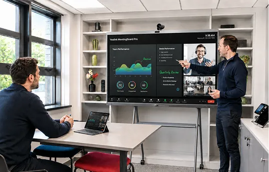 A meeting room running a video call on a large Yealink MeetingBoard screen