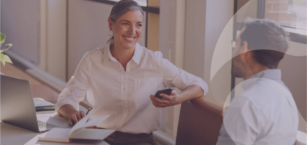 Management communication in the workplace, showing leaders sharing clear updates with employees