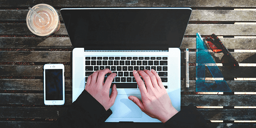 typing-with-both-hands-on-laptop