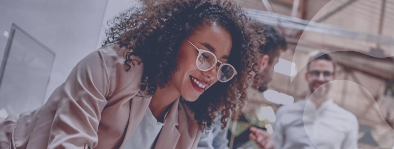 Millennial employees collaborating in a modern workplace, illustrating strategies for attracting millennials and improving retention