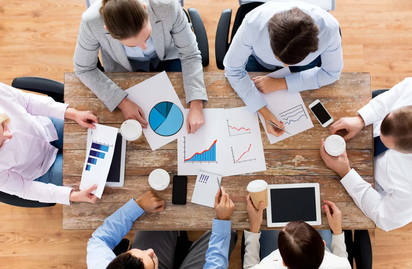 inter departments discussing ideas in office meeting
