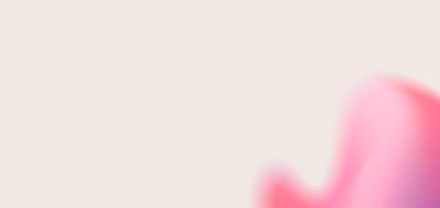 Abstract gradient with soft pink and red hues blending in the bottom right corner on a light beige background.