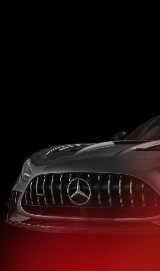 Front view of a sleek black Mercedes-Benz car with illuminated grille and logo against a black background.
