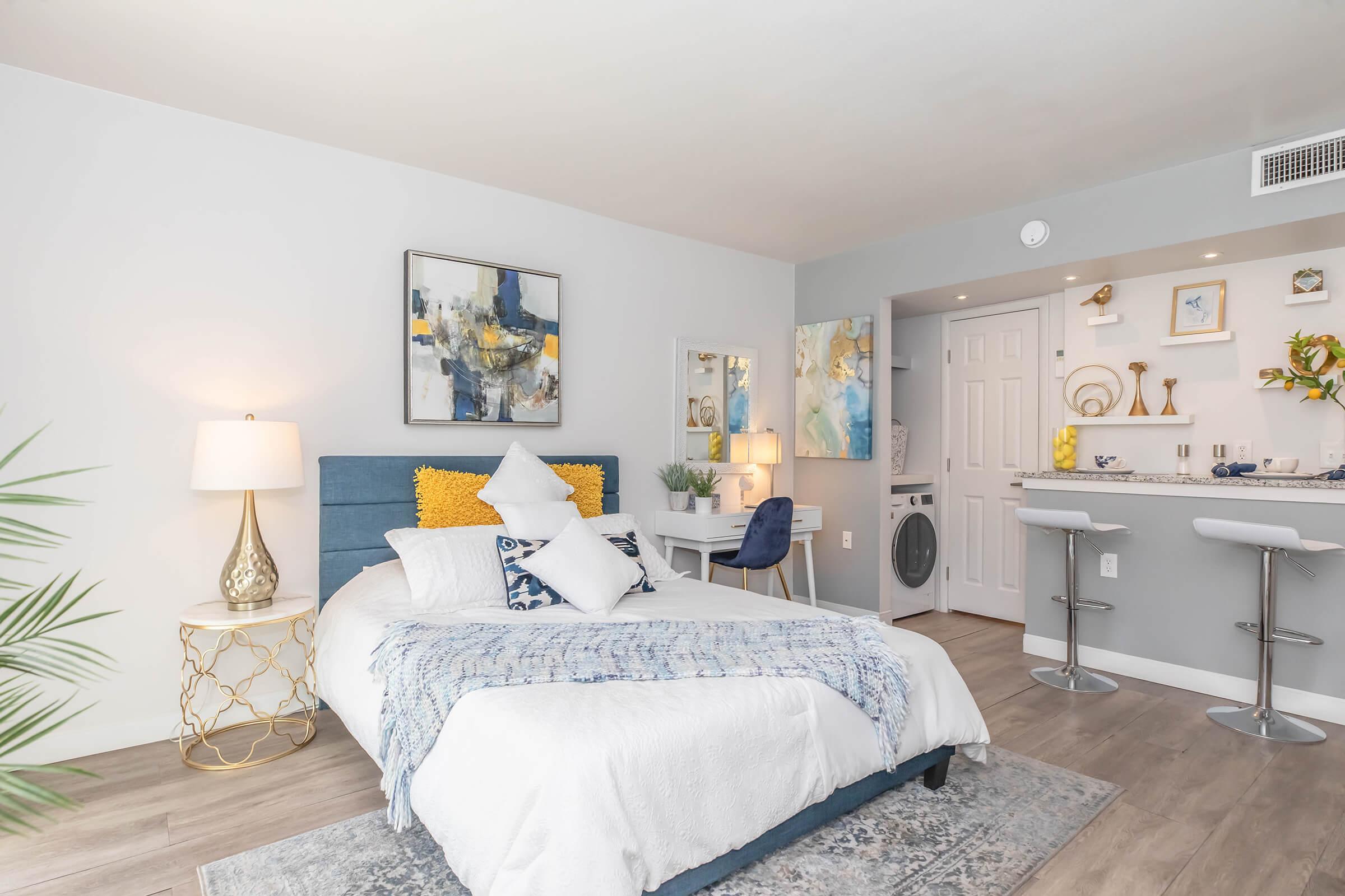 Studio bedroom area with bed