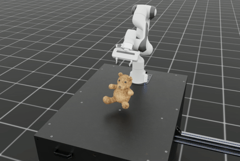 Digital twin of robot arm holds a toy