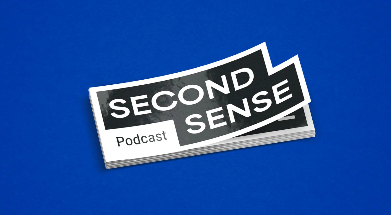 Stack of rectangular stickers with bold text 'SECOND SENSE' and smaller text 'Podcast' on a blue background.