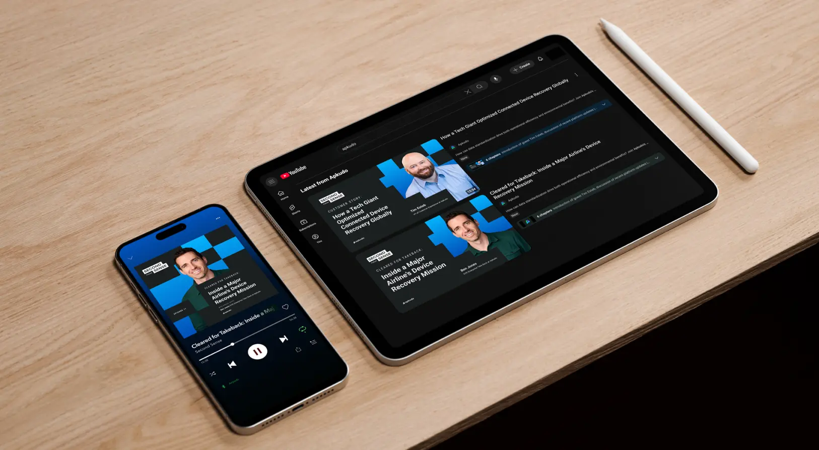 Smartphone and tablet on a wooden surface displaying a podcast titled 'Second Sense' with episodes about device recovery missions.