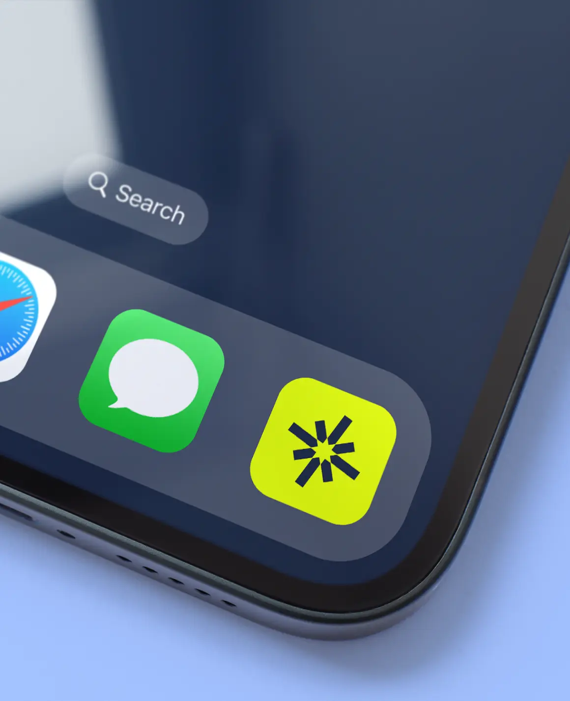 Close-up of a smartphone screen showing Safari, Messages, and a yellow app icon with a black starburst symbol on the dock.