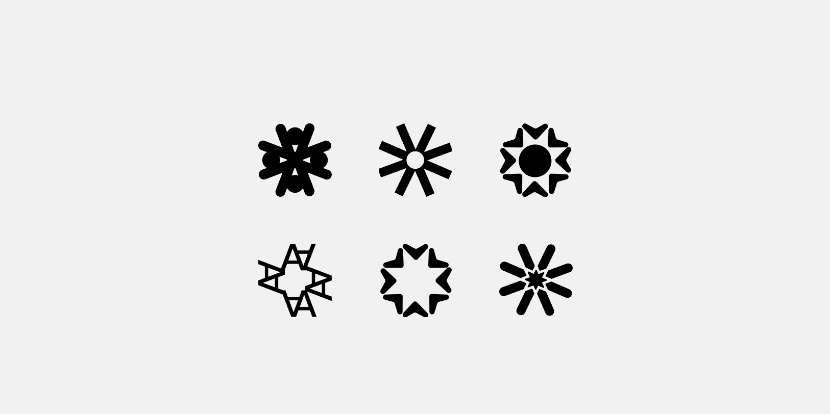 Six black icon designs arranged in two rows of three on a light gray background, each resembling stylized star or flower shapes with varying petal and center designs.
