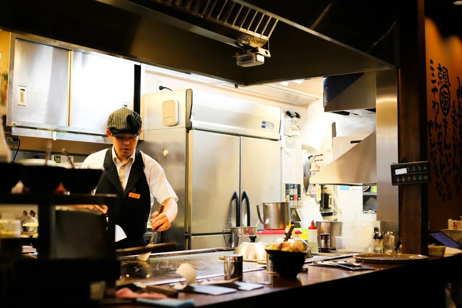 Chef working in a commercial kitchen — temperature logging and food safety compliance in contract catering