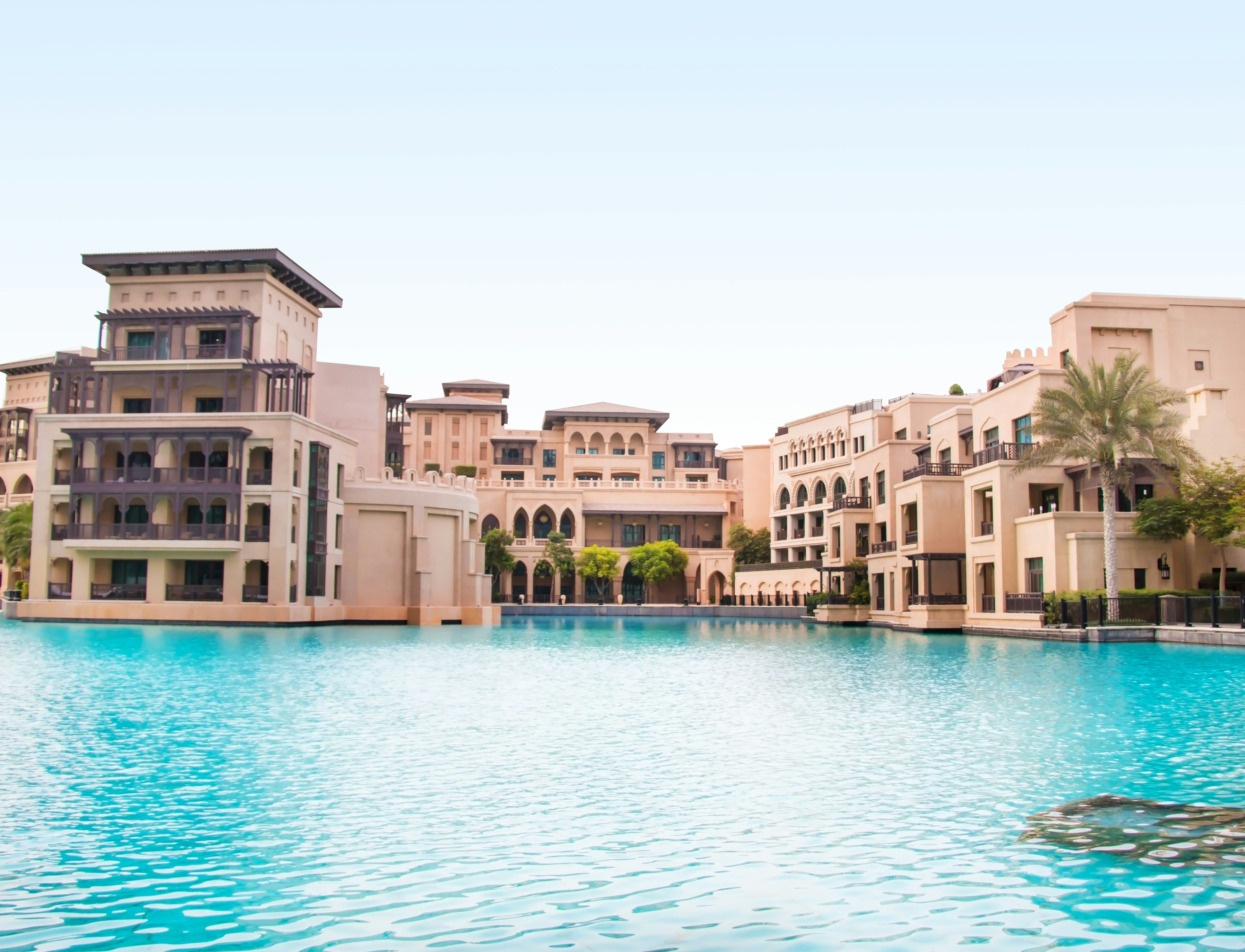 Luxury hotel property exterior with pool — hotel acquisition due diligence beyond financial assessment