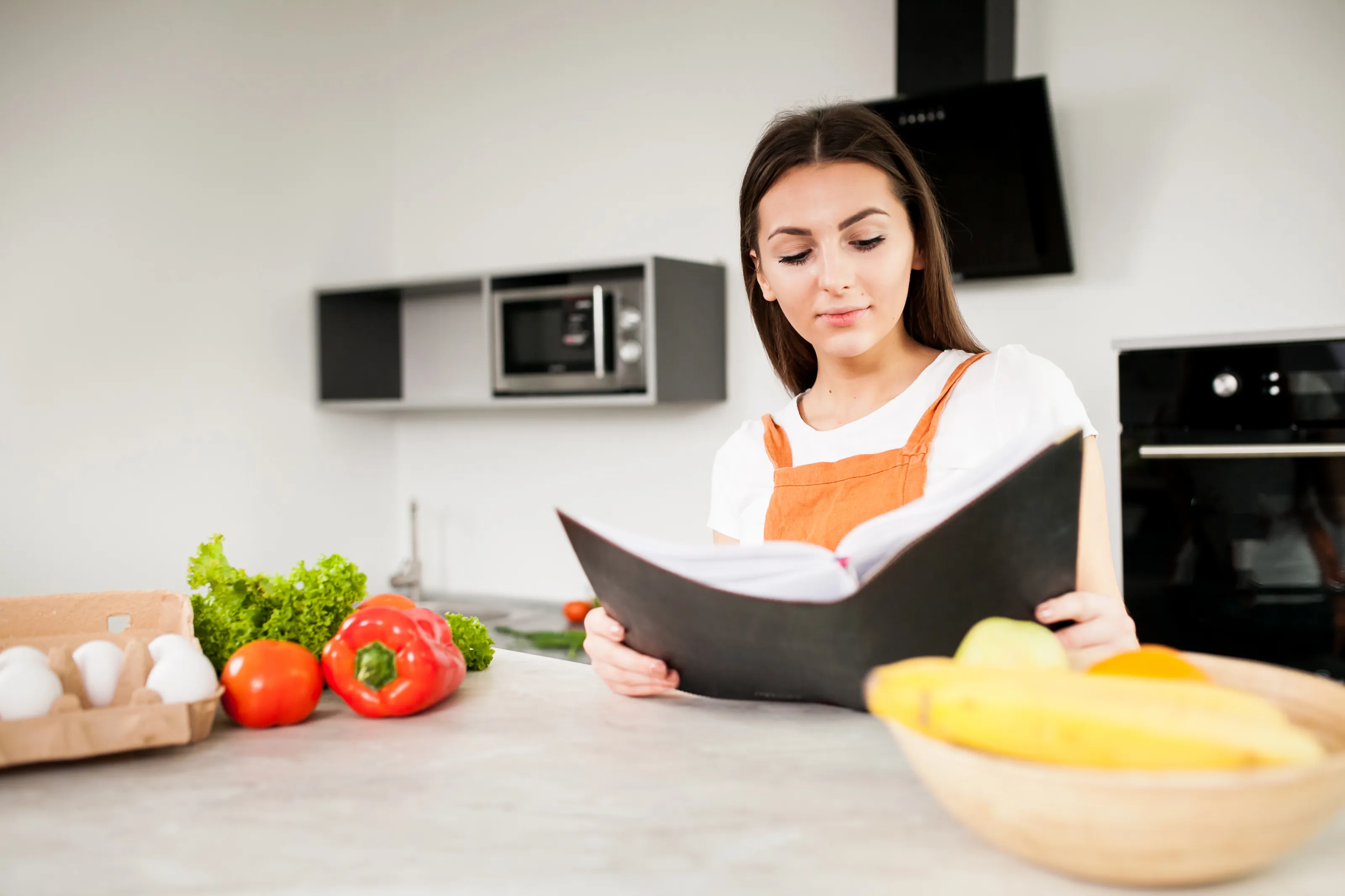 Reviewing health and safety documentation in a kitchen environment — eight core areas covered by a hospitality H&S audit