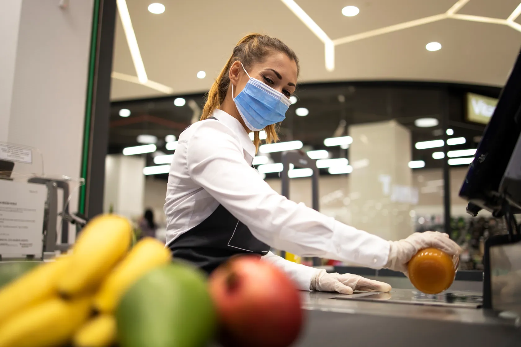 Food handler with mask and gloves following hygiene procedures — food safety competence observed during an EHO confidence in management assessment