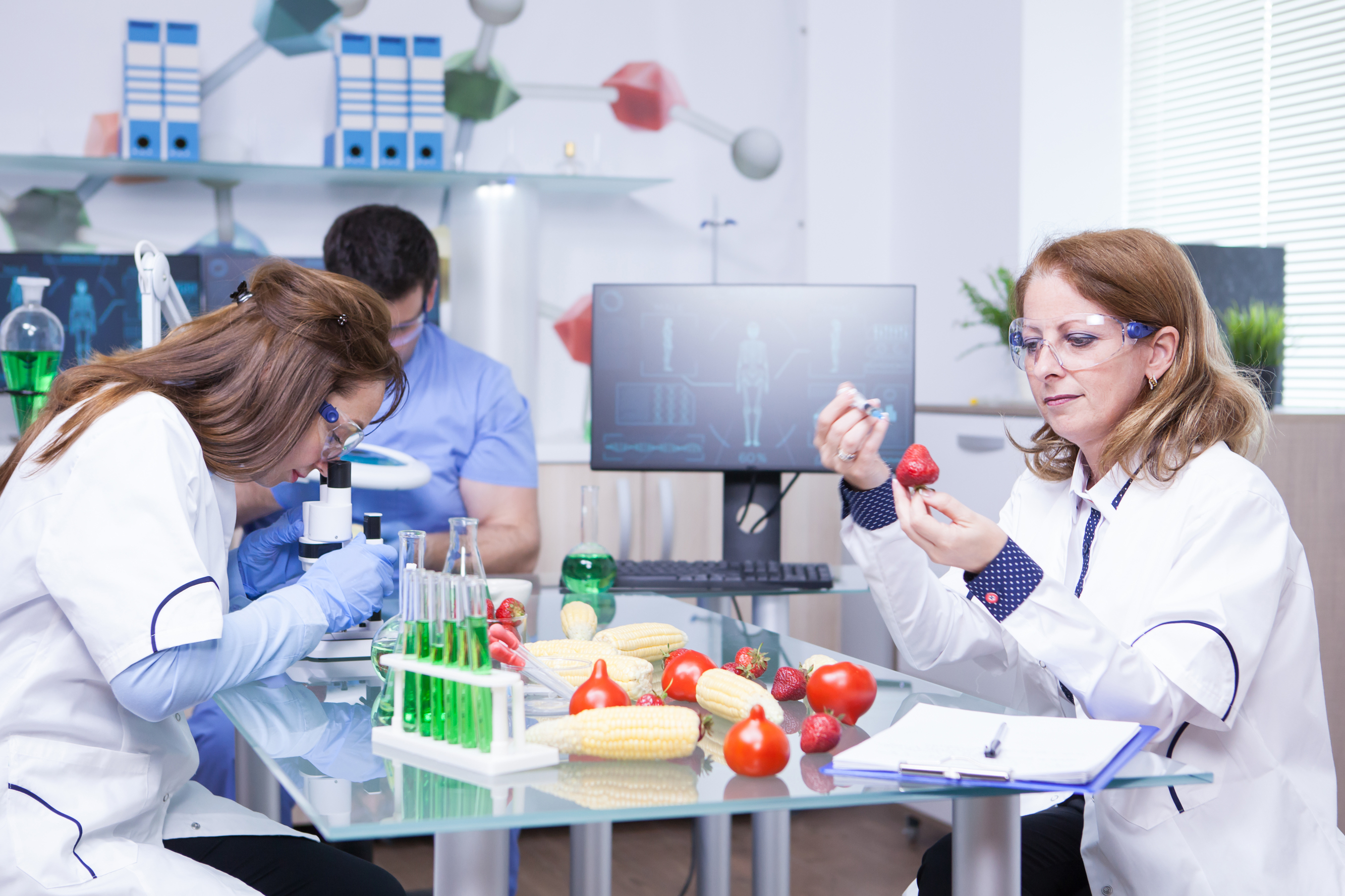Food safety specialists examining produce samples — independent verification of food safety competence standards