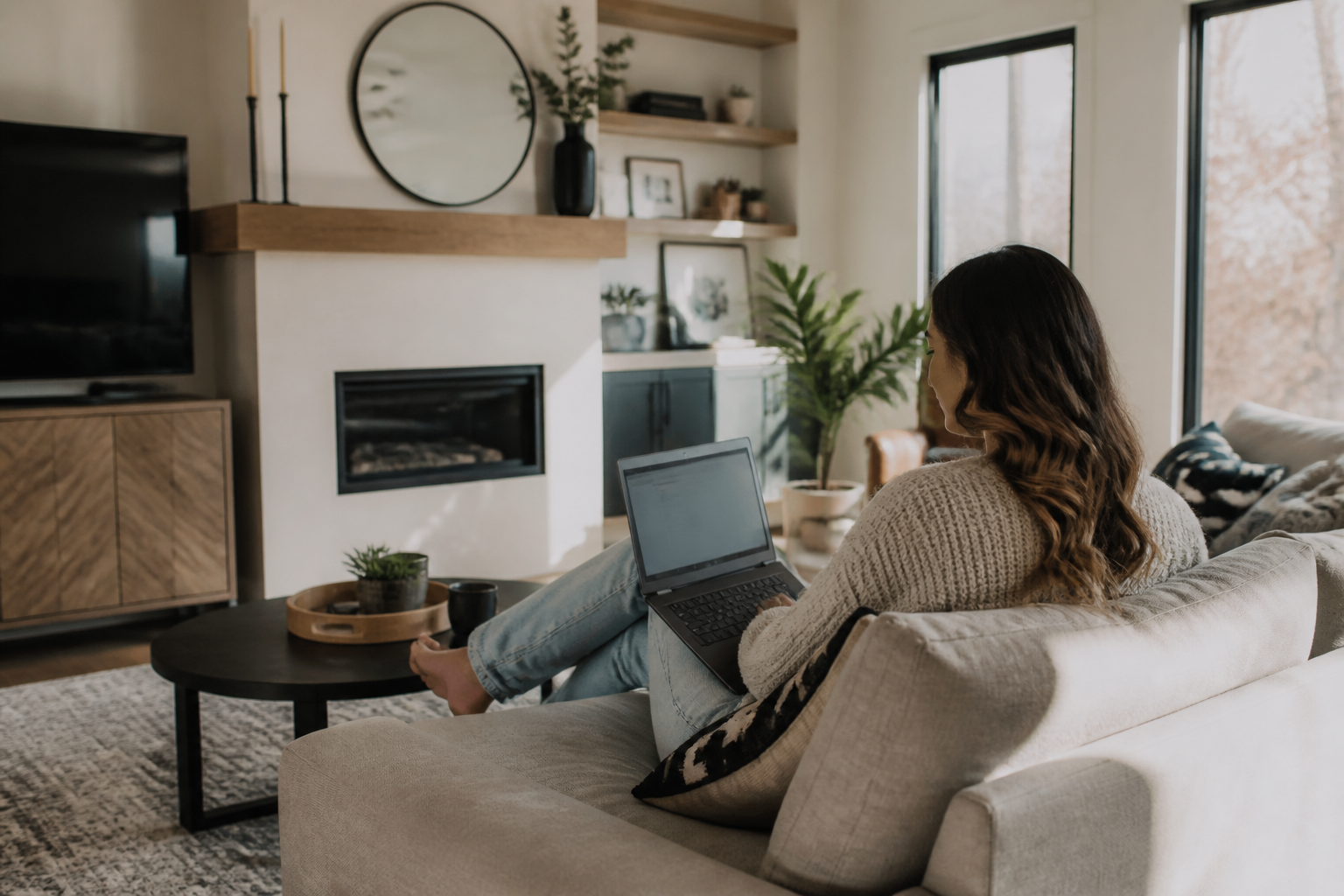 Person using laptop with home internet connectivity