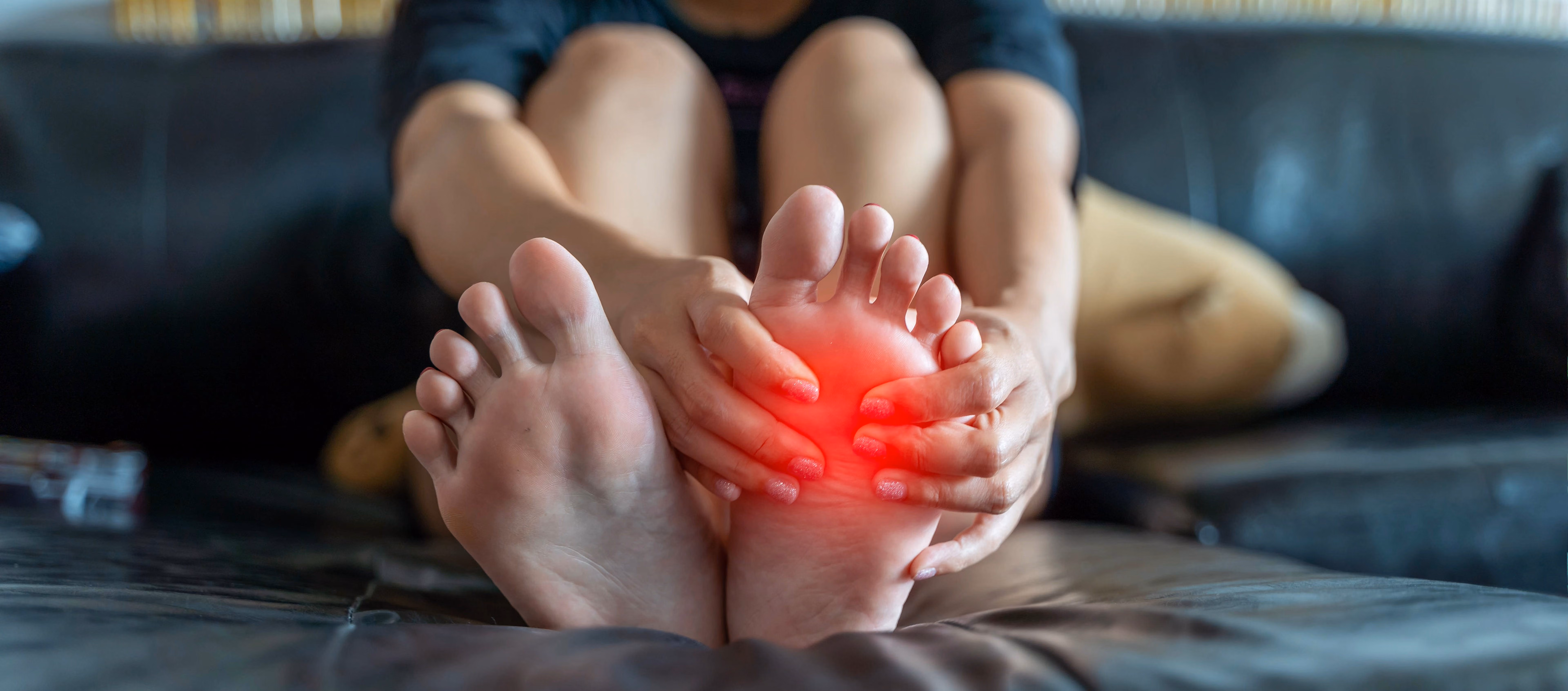 Woman experiencing burning in feet, a common neuropathy symptom, seeking evaluation from the best doctor for neuropathies in Lancaster, CA.