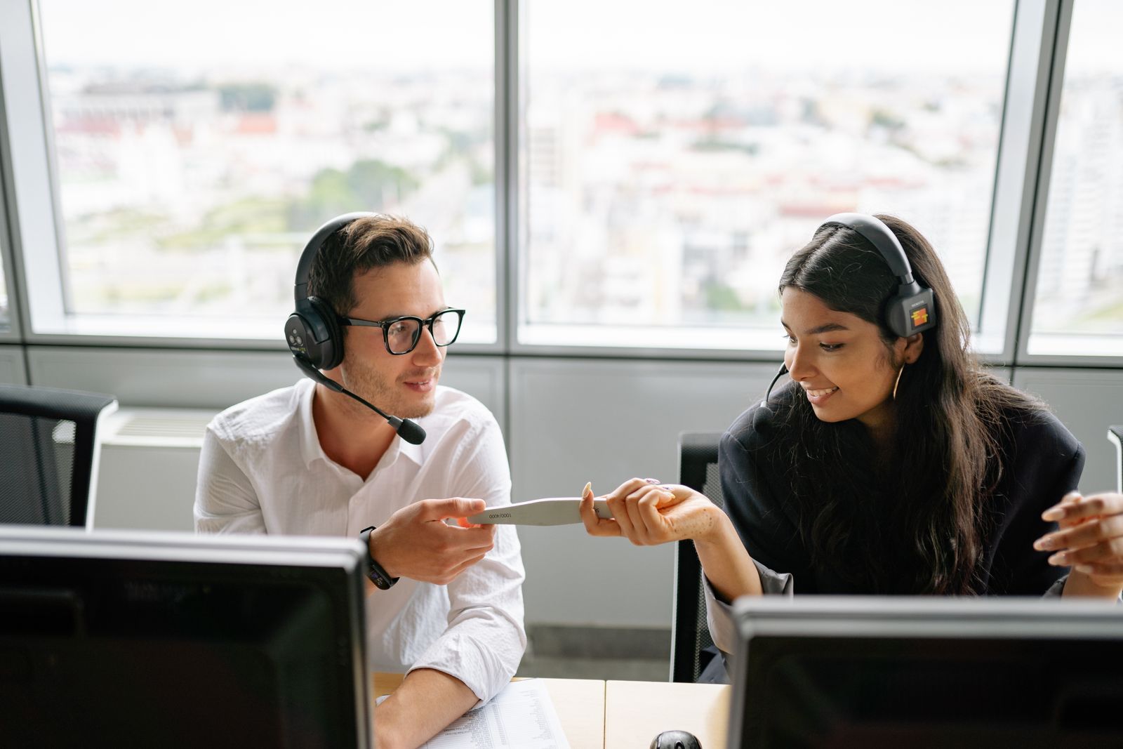 Two IT professionals collaborating at a computer