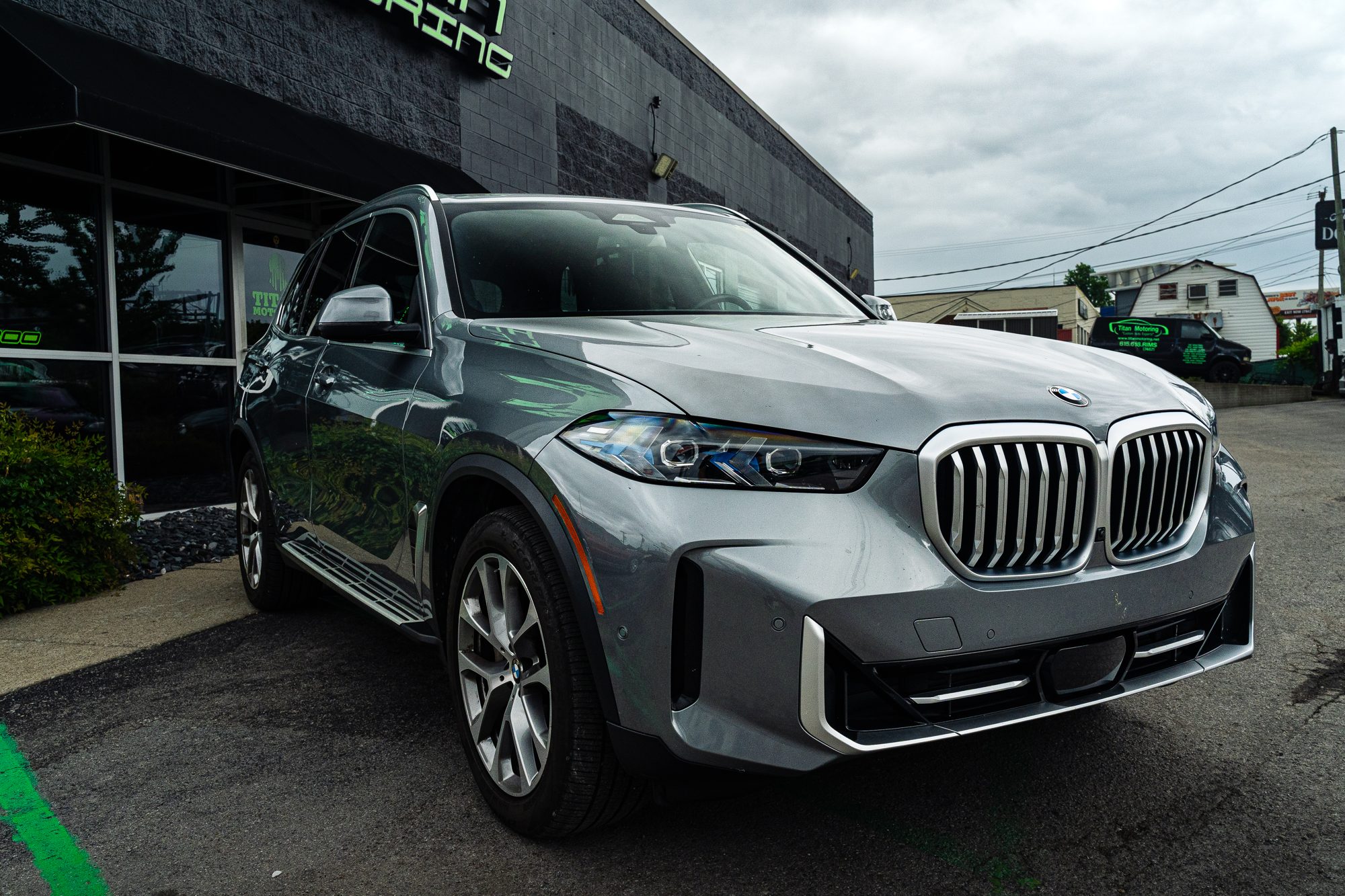 2024 BMW X5 side view, connected tech client vehicle